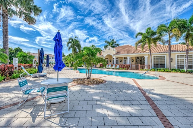 view of swimming pool featuring a patio area