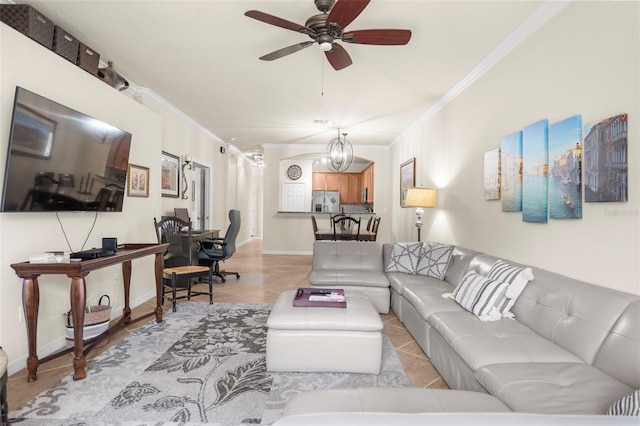 tiled living room with ceiling fan with notable chandelier and ornamental molding