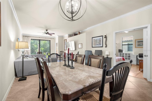 tiled dining area featuring ceiling fan with notable chandelier and ornamental molding