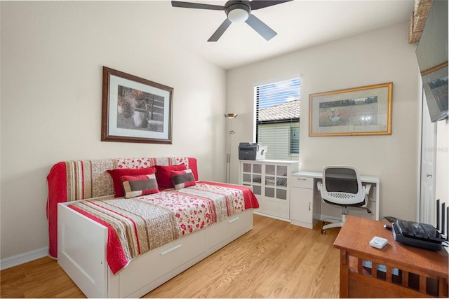 bedroom featuring ceiling fan and light hardwood / wood-style flooring