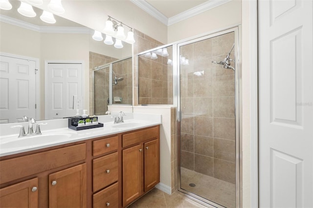 bathroom with crown molding, vanity, walk in shower, and tile patterned floors