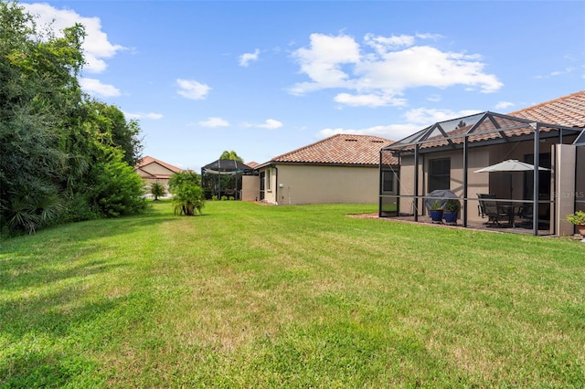 view of yard with a lanai