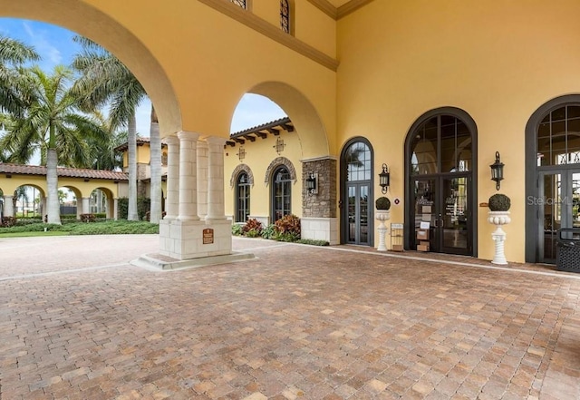 view of exterior entry featuring french doors