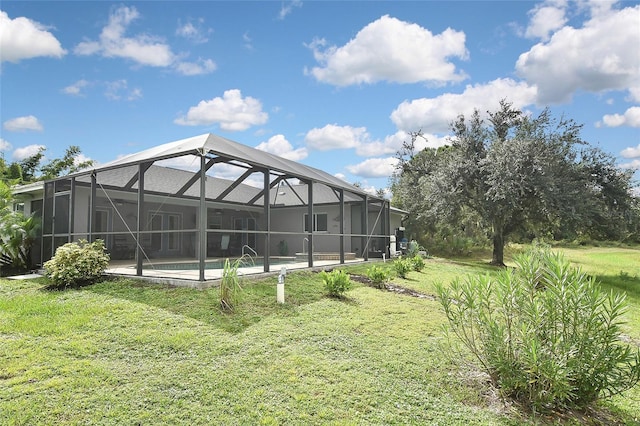 view of yard featuring a pool and glass enclosure