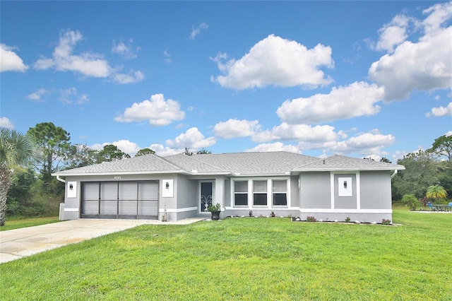 ranch-style home with a garage and a front lawn