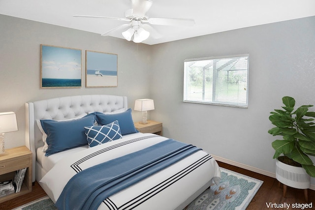 bedroom featuring dark hardwood / wood-style floors and ceiling fan