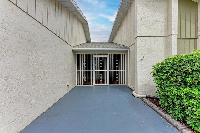 entrance to property with a patio area