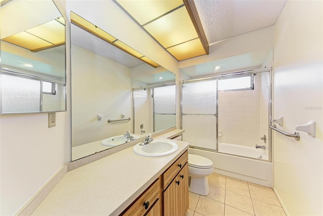 full bathroom featuring tile patterned flooring, vanity, toilet, and enclosed tub / shower combo