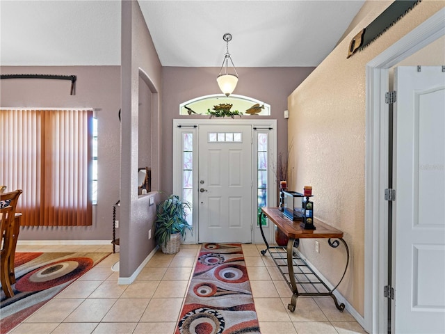 tiled entryway featuring plenty of natural light