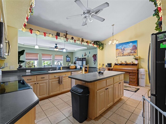 kitchen with ceiling fan with notable chandelier, a center island, stainless steel appliances, sink, and light brown cabinets