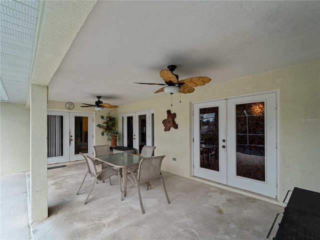 view of patio featuring ceiling fan and french doors