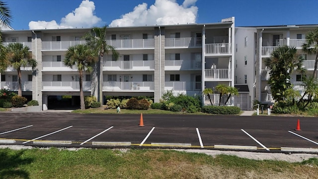 view of property with uncovered parking