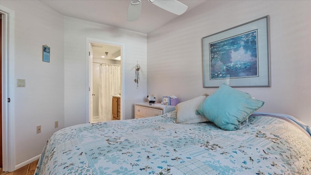 bedroom with baseboards, a ceiling fan, wood finished floors, and connected bathroom