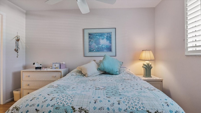 bedroom with light wood-type flooring and ceiling fan