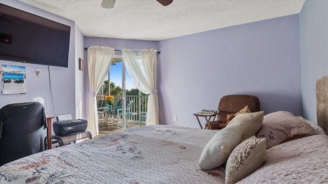 bedroom with a ceiling fan, access to exterior, and a textured ceiling
