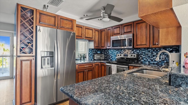 kitchen with a wealth of natural light, visible vents, a sink, and appliances with stainless steel finishes