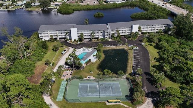 birds eye view of property with a water view