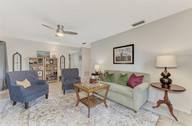 tiled living room featuring ceiling fan