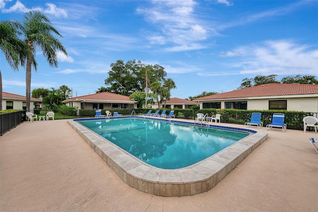 view of swimming pool featuring a patio area