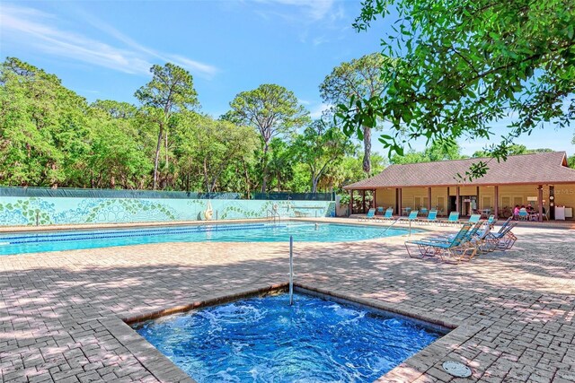 view of swimming pool with a patio area