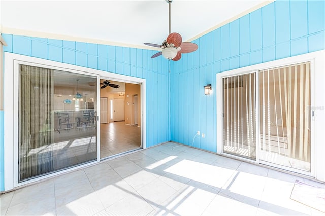 interior space featuring ceiling fan