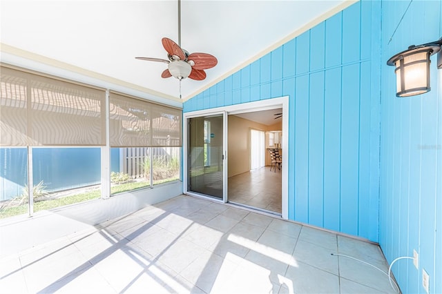 unfurnished sunroom with lofted ceiling and ceiling fan