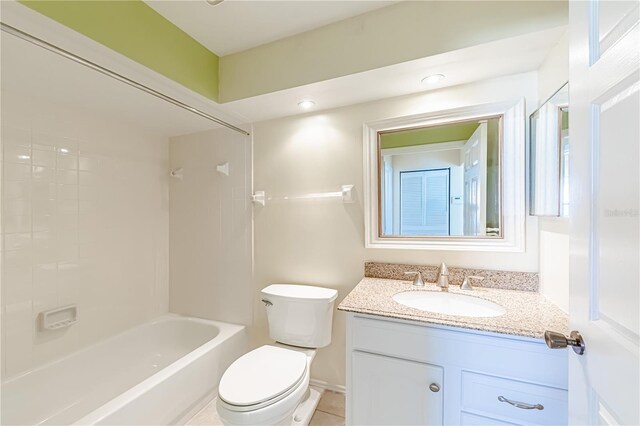 full bathroom with tile patterned floors, shower / bath combination, toilet, and vanity