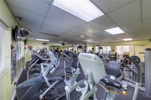 gym with a paneled ceiling