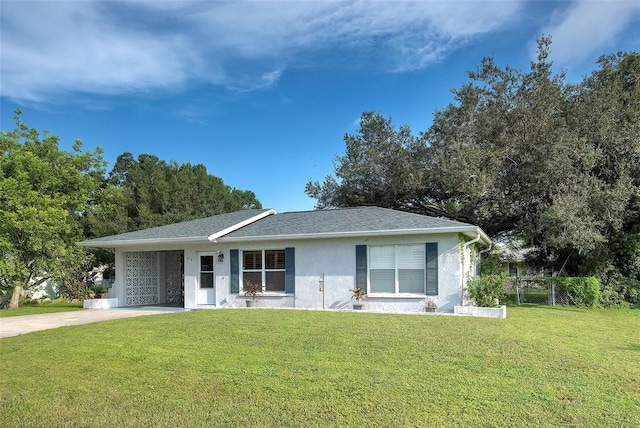 single story home featuring a garage and a front yard