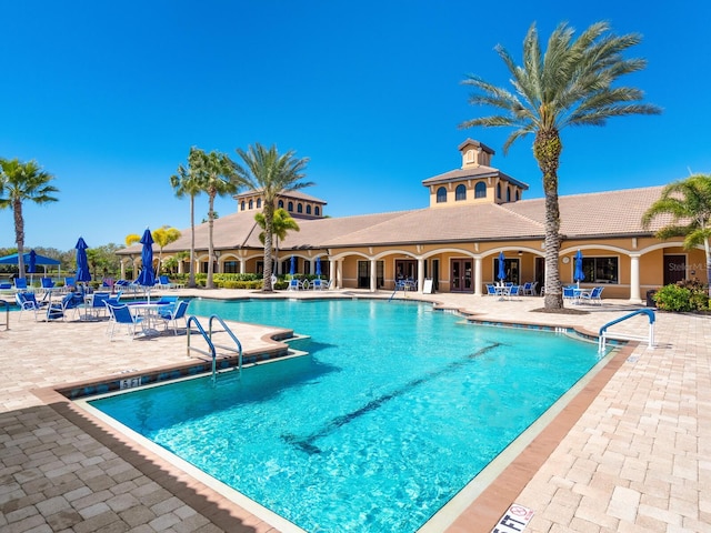 view of swimming pool with a patio area