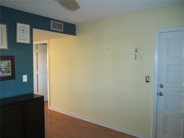 spare room with hardwood / wood-style flooring