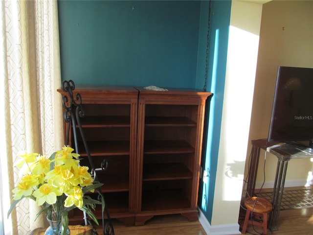 stairs with hardwood / wood-style floors