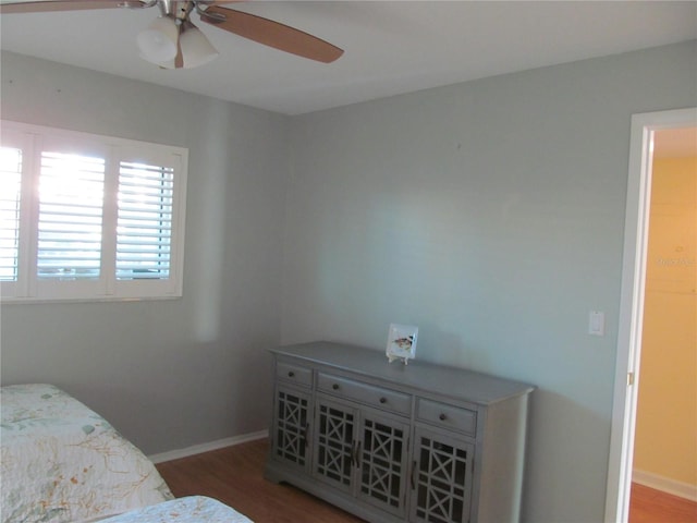 bedroom with wood-type flooring and ceiling fan