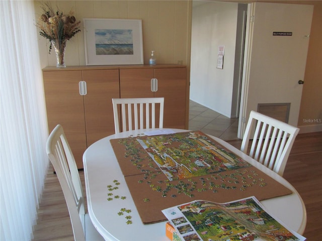 dining area with wood-type flooring