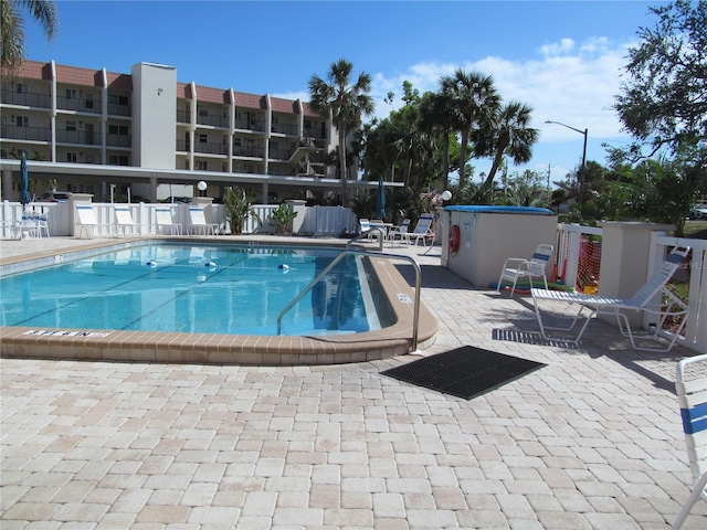 view of pool featuring a patio area