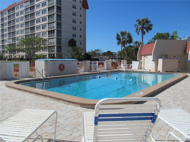 view of swimming pool featuring a patio area