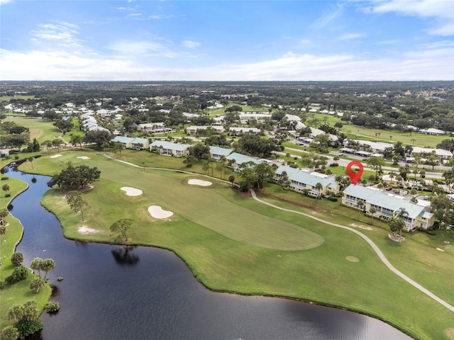 aerial view with view of golf course and a water view