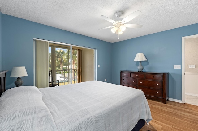 bedroom featuring access to outside, a textured ceiling, light wood-type flooring, and ceiling fan