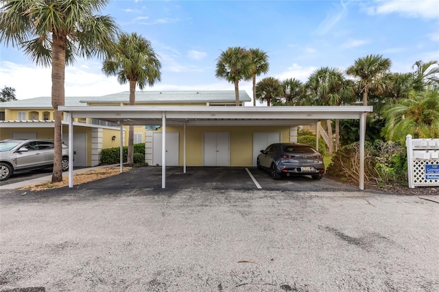 view of vehicle parking with a carport