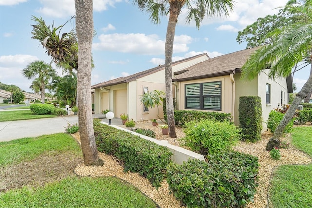 single story home featuring a garage