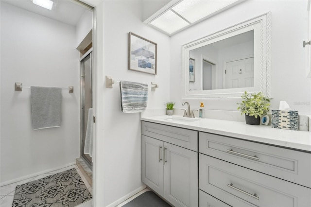 bathroom featuring vanity, tile patterned floors, and an enclosed shower