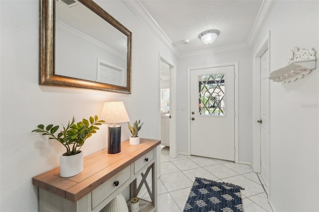 entryway with a textured ceiling, light tile patterned floors, and crown molding