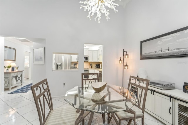 tiled dining space with a notable chandelier