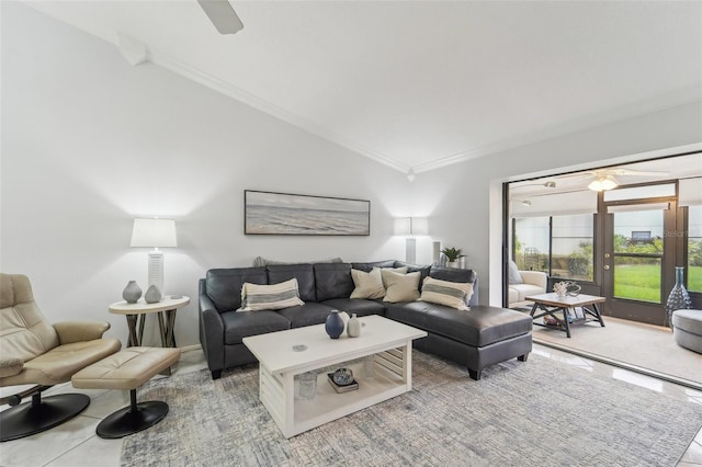 living room featuring ceiling fan, crown molding, and vaulted ceiling