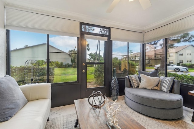 sunroom / solarium featuring ceiling fan