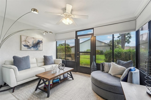 living room featuring light tile patterned floors and ceiling fan