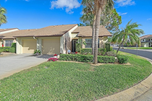 ranch-style house with a front yard and a garage