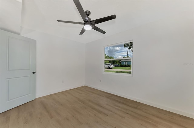 unfurnished room with light wood-style flooring, baseboards, and ceiling fan