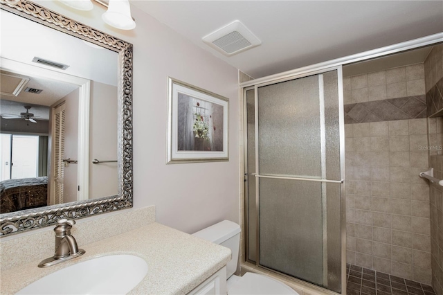 full bathroom featuring toilet, visible vents, a tile shower, and connected bathroom