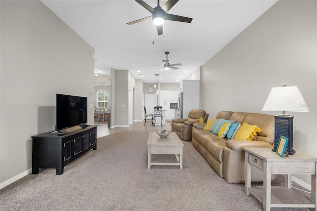 living area with recessed lighting, light carpet, ceiling fan, and baseboards